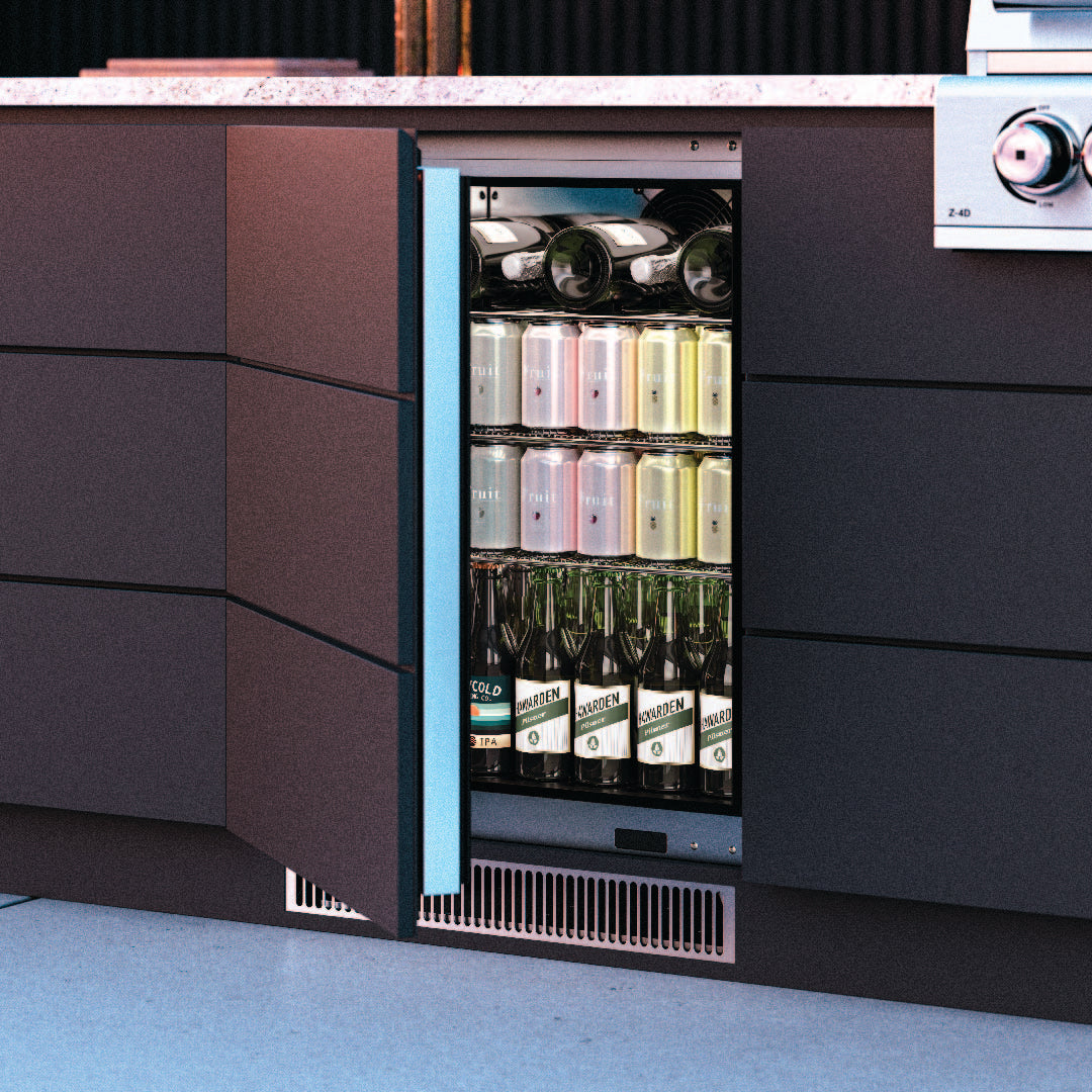 Blastcool iXP1-840-R built into a dark alfresco kitchen bench with a matching decor panel on the door, opened to show wine, cans and beer inside