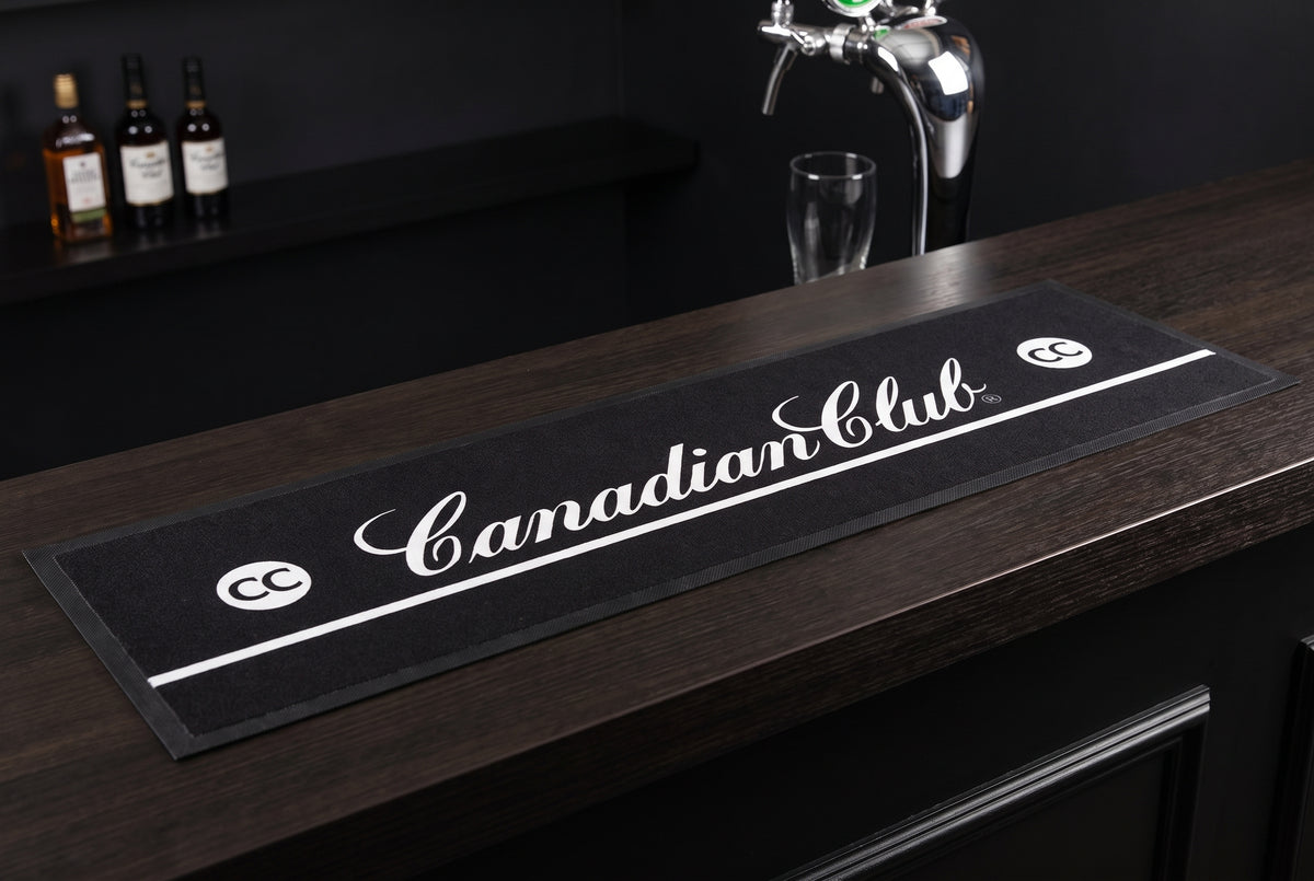 Canadian Club Premium Rubber-Backed Bar Mat Runner on a bar top