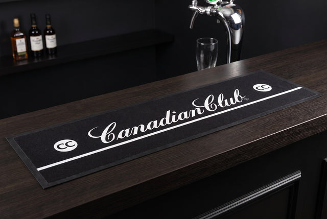 Canadian Club Premium Rubber-Backed Bar Mat Runner on a bar top