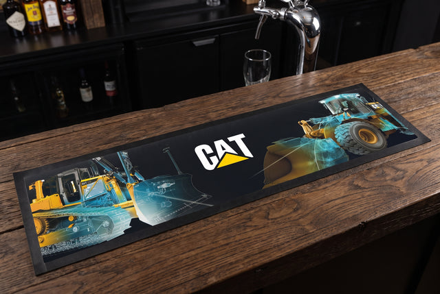 Caterpillar CAT Diggers Premium Rubber-Backed Bar Mat Runner on a bar top