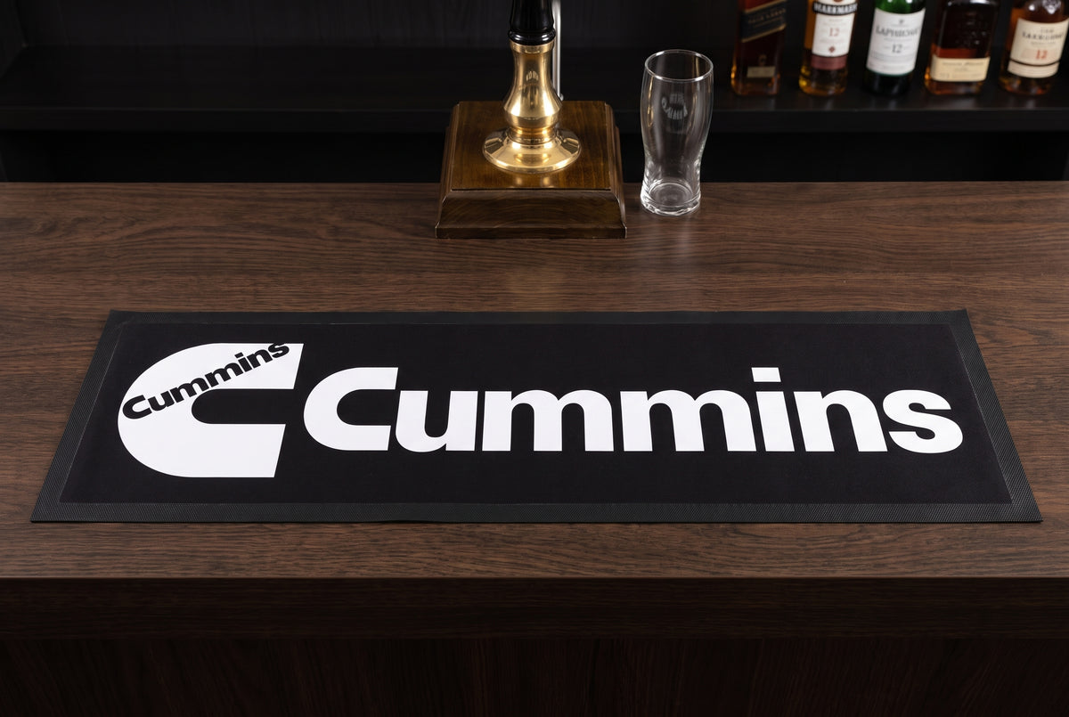 Cummins Black Premium Rubber-Backed Bar Mat Runner on a bar top