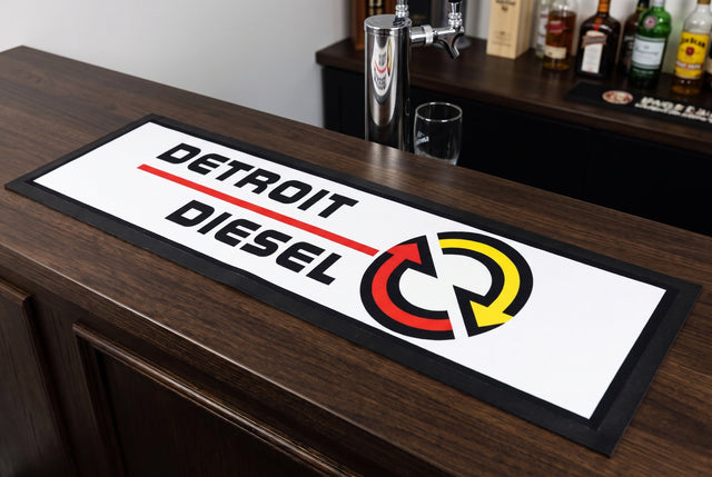 Detroit Diesel Premium Rubber-Backed Bar Mat Runner on a bar top