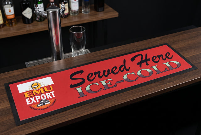 Emu Export "Served Here Ice Cold" Premium Rubber-Backed Bar Mat Runner on a bar top