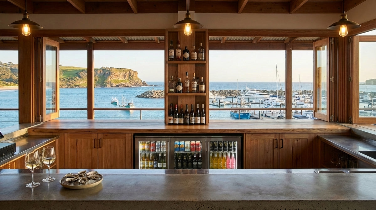 Rhino ENV2H 2-door outdoor bar fridge behind waterfront bar counter with marina views