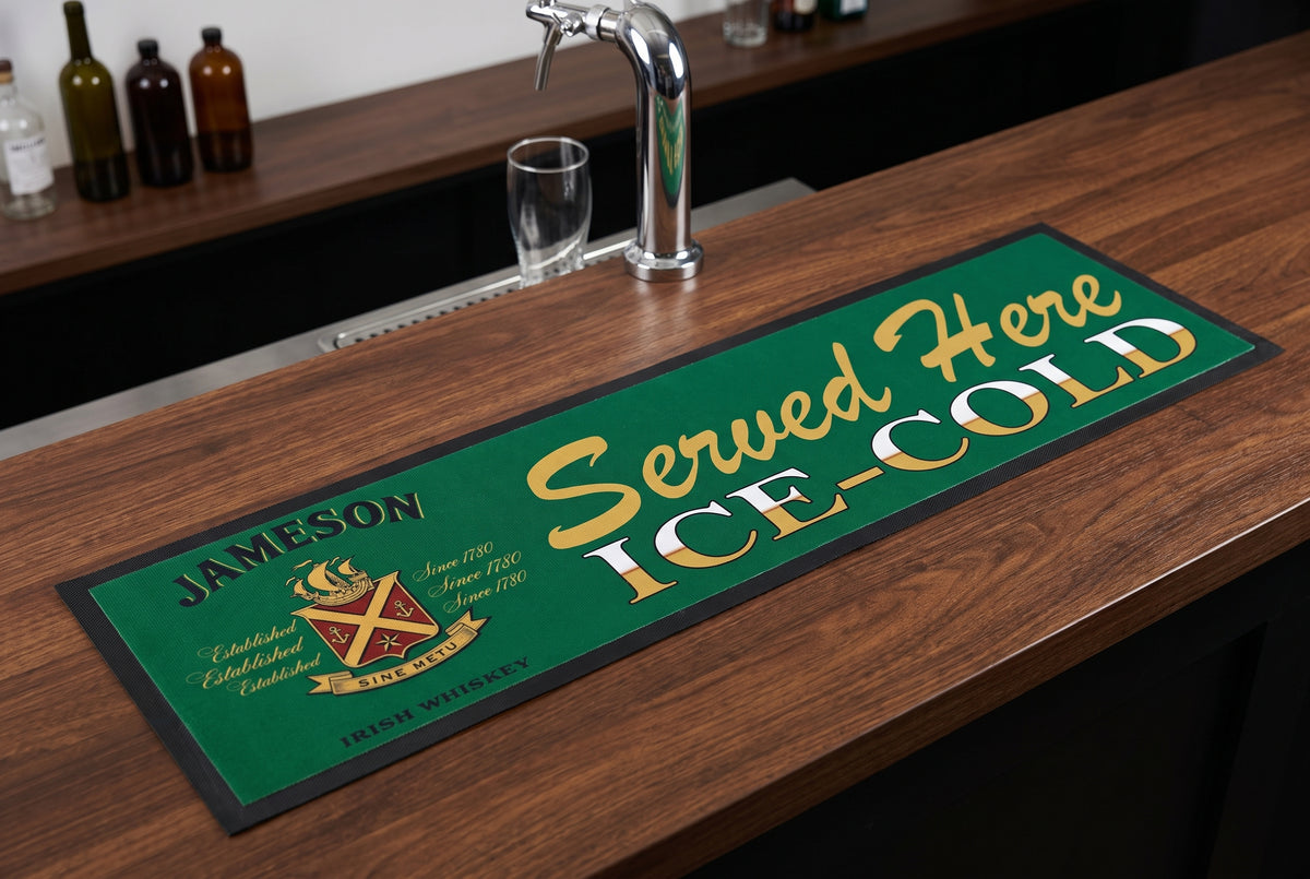 Jameson "Served Here Ice Cold" Premium Rubber-Backed Bar Mat Runner on a bar top