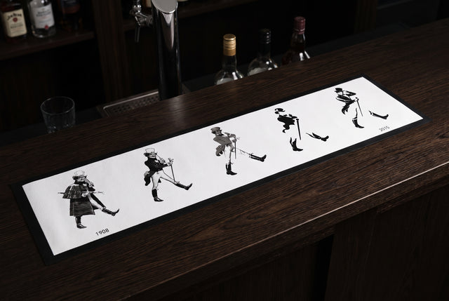 Johnnie Walker Evolution Premium Rubber-Backed Bar Mat Runner on a bar top