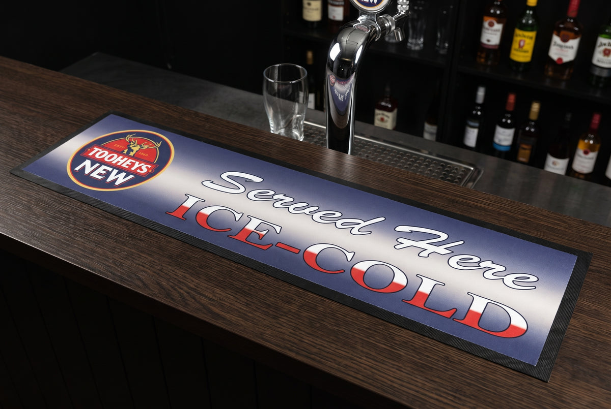 Tooheys "Served Here Ice Cold" Premium Rubber-Backed Bar Mat Runner on a bar top