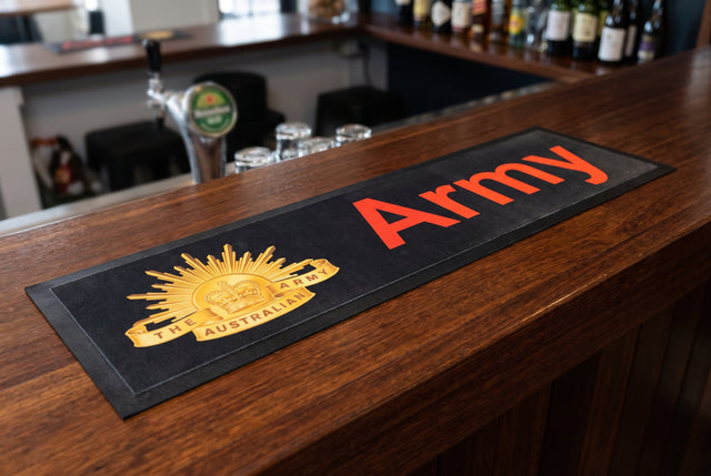 Army Premium Rubber-Backed Bar Mat Runner on a bar top