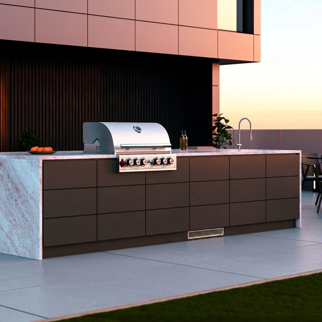 Blastcool iXP1-840-R fully integrated into an alfresco kitchen run, door closed and faced with a matching cabinet panel so only the stainless kickboard ventilation grille is visible