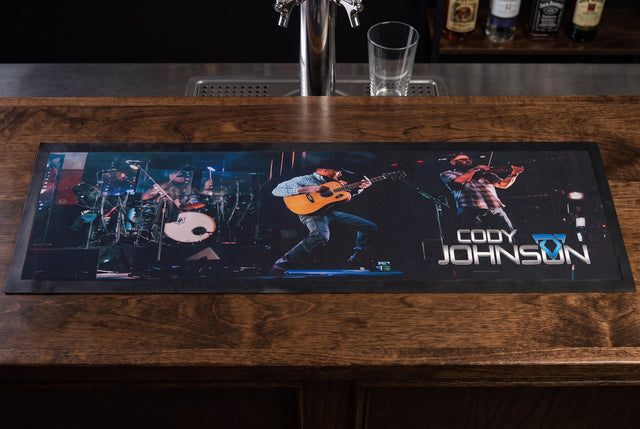Cody Johnson Premium Rubber-Backed Bar Mat Runner on a bar top