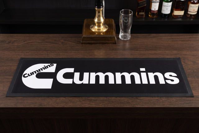 Cummins Black Premium Rubber-Backed Bar Mat Runner on a bar top