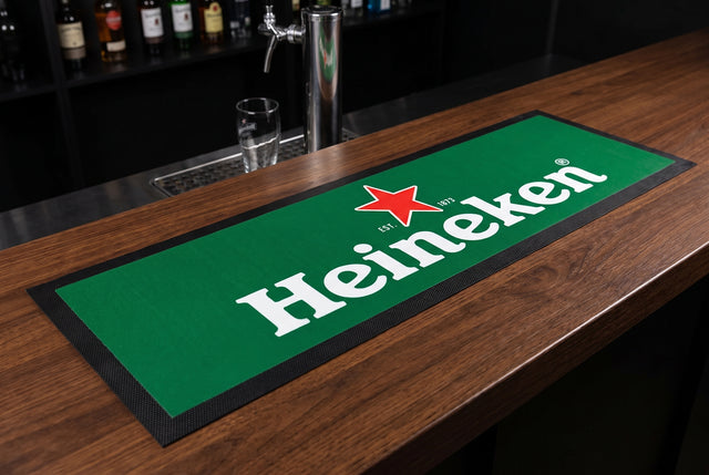 Heineken Premium Rubber-Backed Bar Mat Runner on a bar top