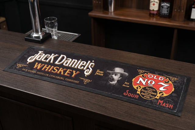 Jack Daniel's Whiskey Premium Rubber-Backed Bar Mat Runner on a bar top
