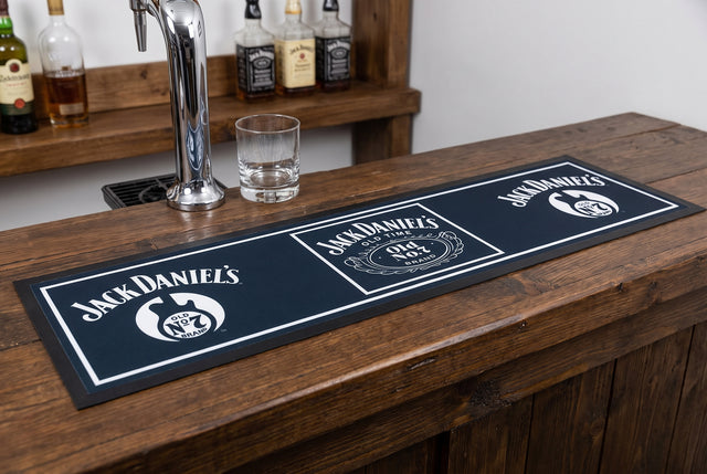 Jack Daniel's Premium Rubber-Backed Bar Mat Runner on a bar top