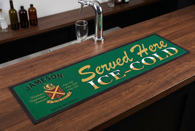 Jameson "Served Here Ice Cold" Premium Rubber-Backed Bar Mat Runner on a bar top