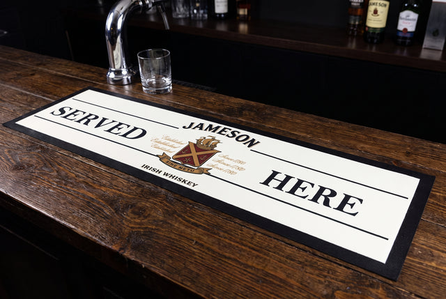 Jameson Served Here Premium Rubber-Backed Bar Mat Runner on a bar top