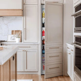 Schmick MSL330 integrated upright fridge behind cabinetry in a modern kitchen, door open showing the stocked shelves inside