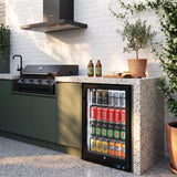 Schmick SK126L-B-HD black single door bar fridge built into a courtyard outdoor kitchen beside a black built-in BBQ and rangehood