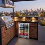 Schmick SK126L-HD bar fridge built into an outdoor kitchen: rooftop terrace kitchen at twilight, stainless bbq and rangehood