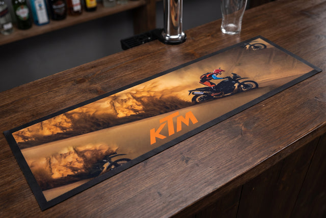 KTM Motorcycles Bar Premium Rubber-Backed Bar Mat Runner on a bar top