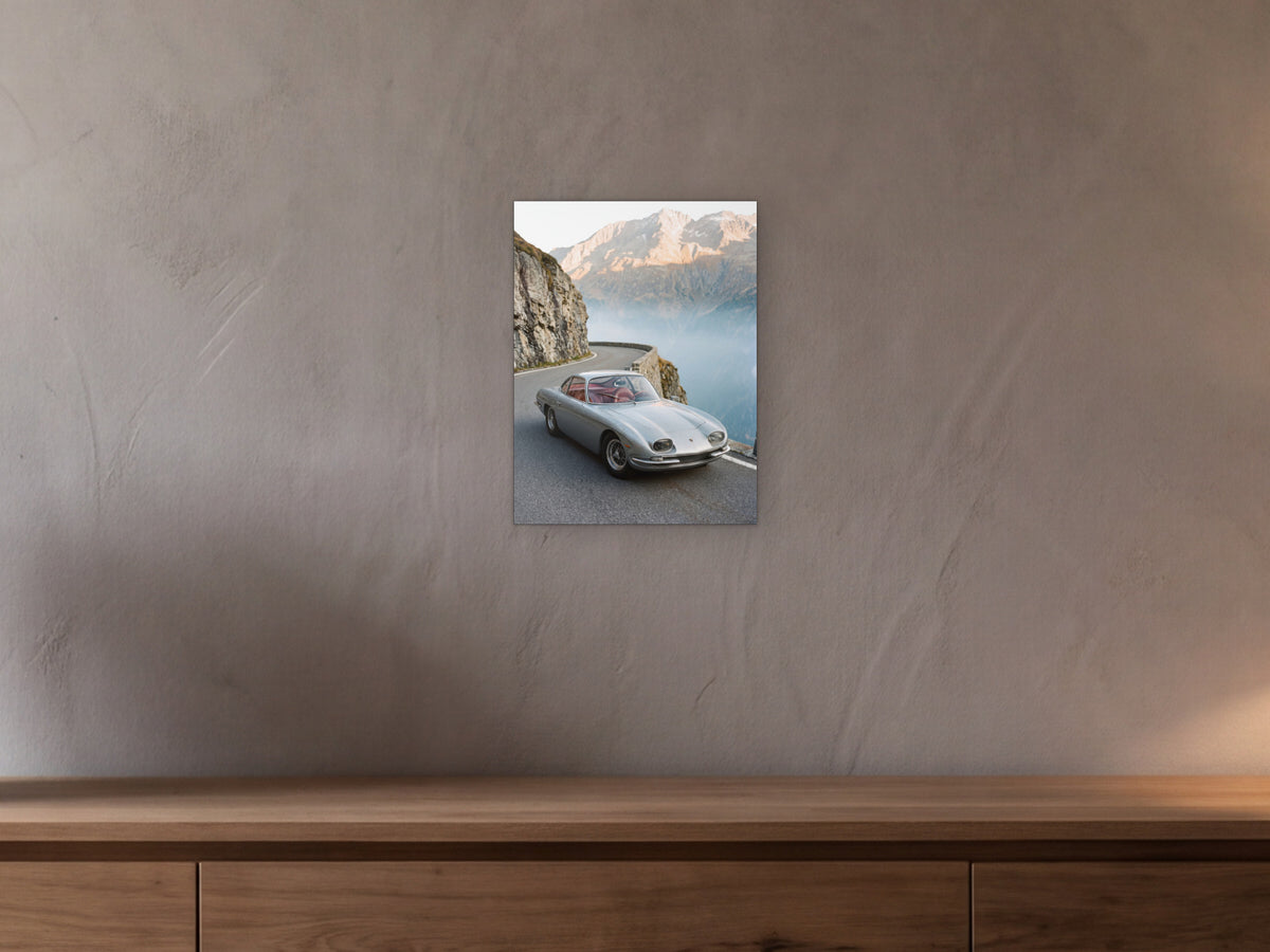 Lamborghini 350 GT - Alpine Pass shown in a beamed room with a greige plaster wall above a long oak sideboard - scale render at 30 x 40 cm