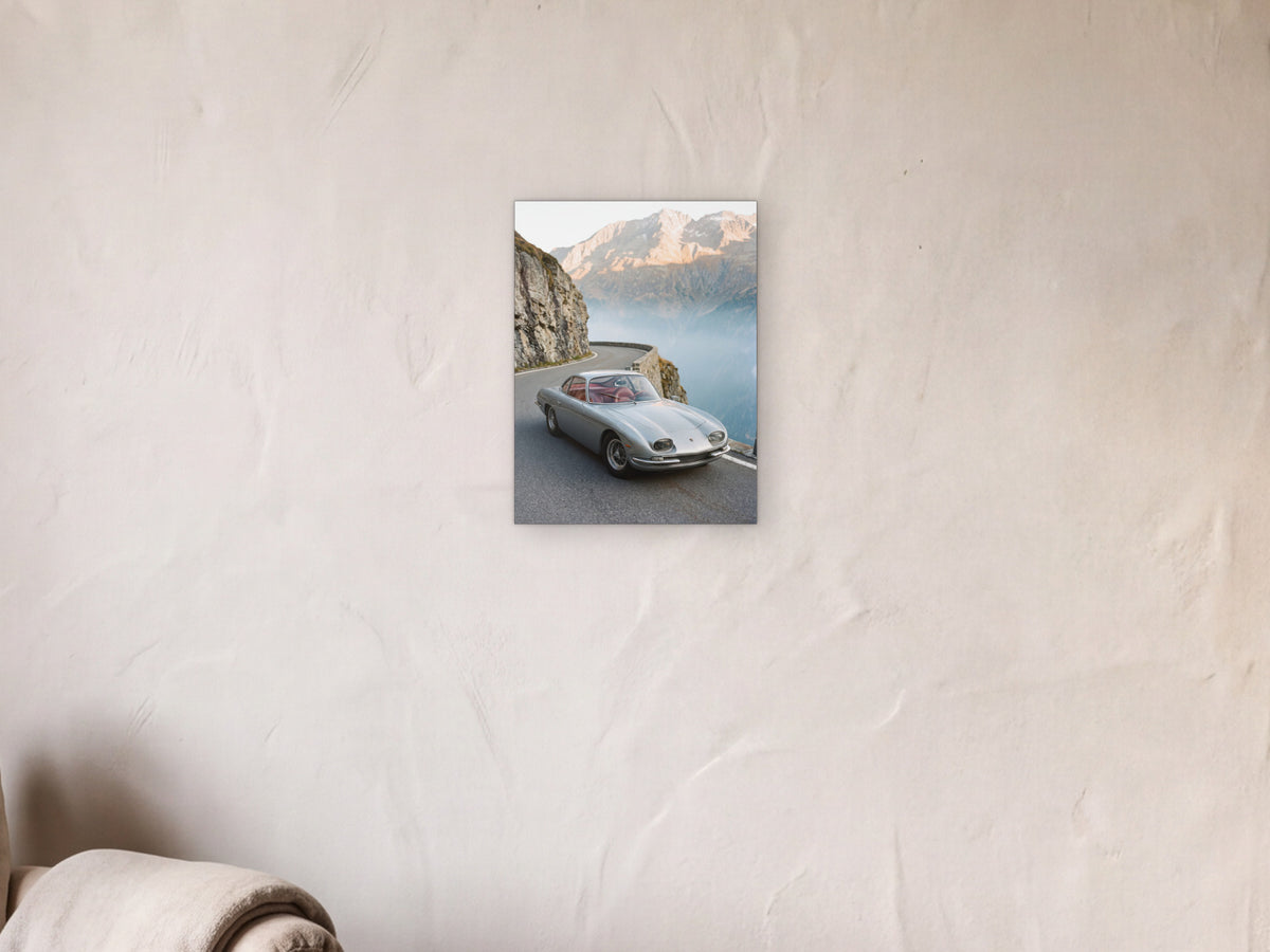 Lamborghini 350 GT - Alpine Pass shown in a limewash reading corner beside an armchair and a floor lamp - scale render at 30 x 40 cm