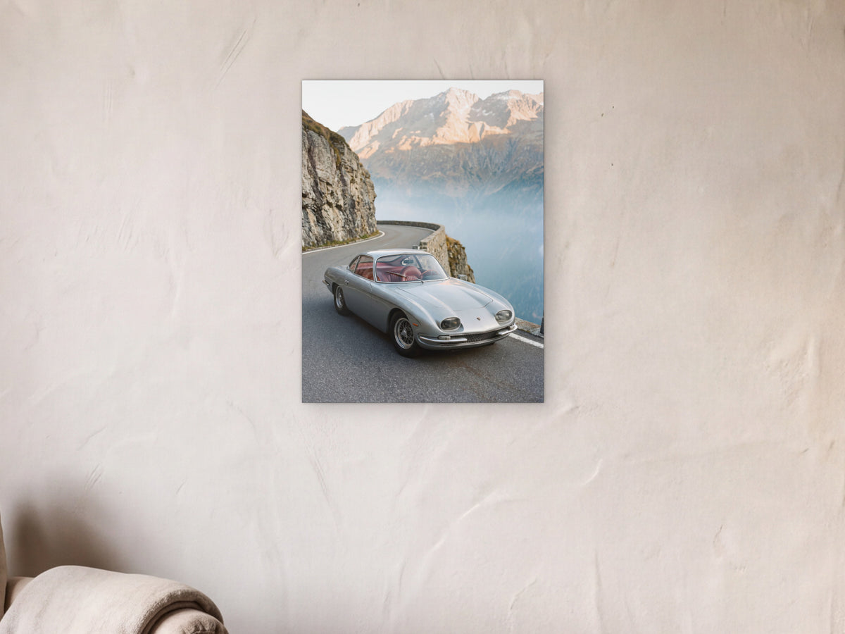 Lamborghini 350 GT - Alpine Pass shown in a limewash reading corner beside an armchair and a floor lamp - scale render at 45 x 60 cm