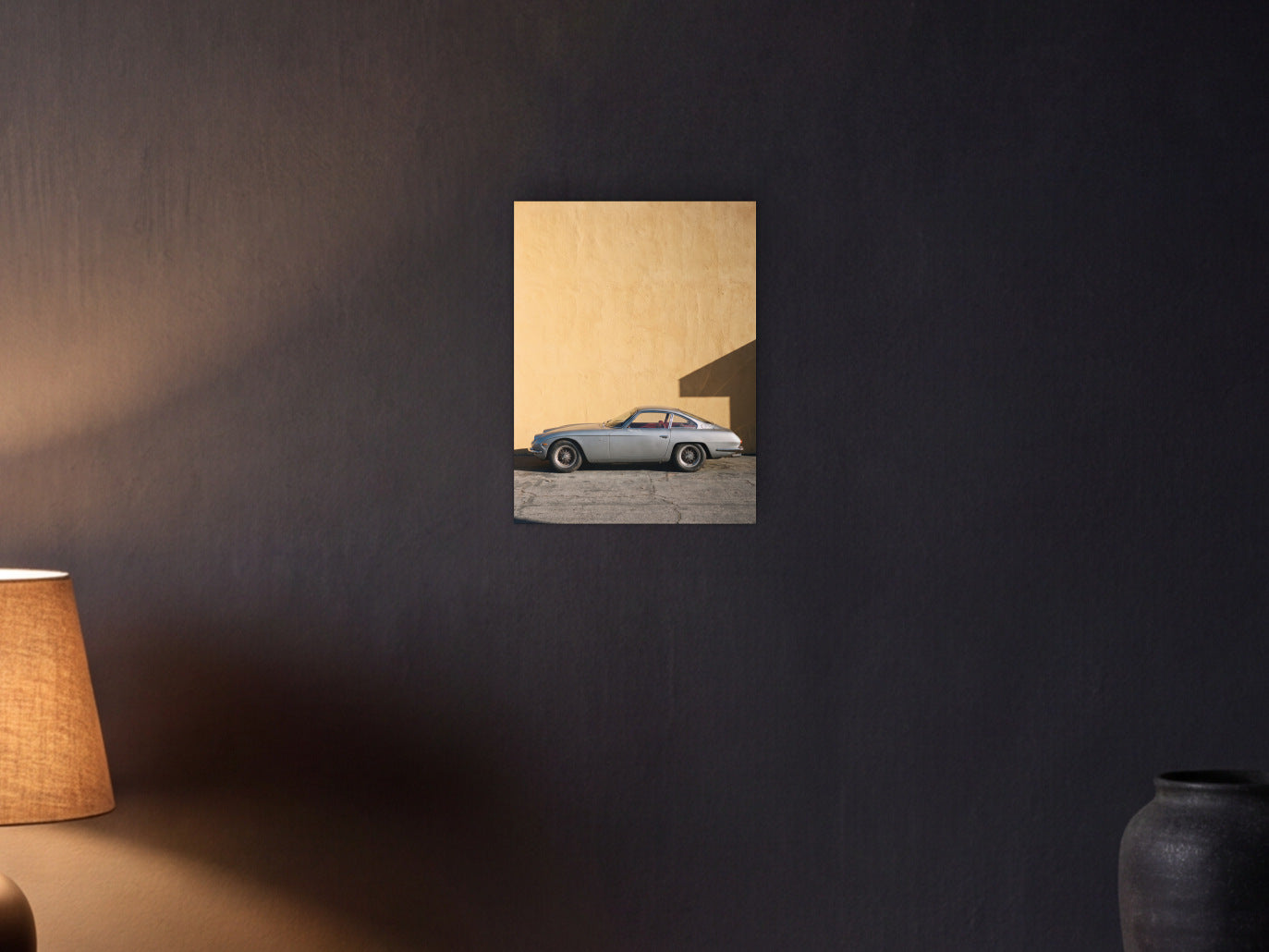 Lamborghini 350 GT - Ochre Wall shown in a graphite plaster wall at night, lit by a console lamp - scale render at 30 x 40 cm