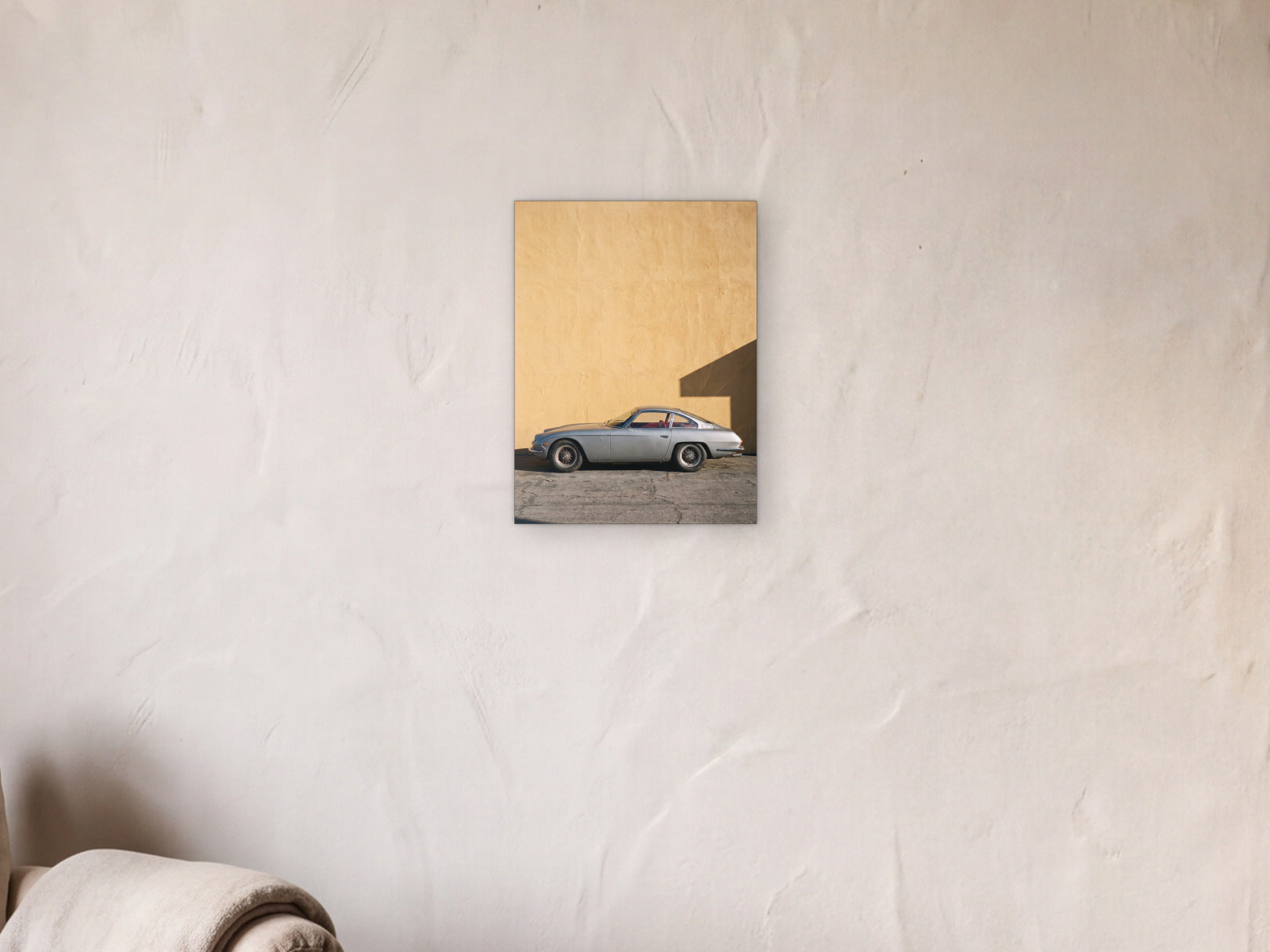 Lamborghini 350 GT - Ochre Wall shown in a limewash reading corner beside an armchair and a floor lamp - scale render at 30 x 40 cm