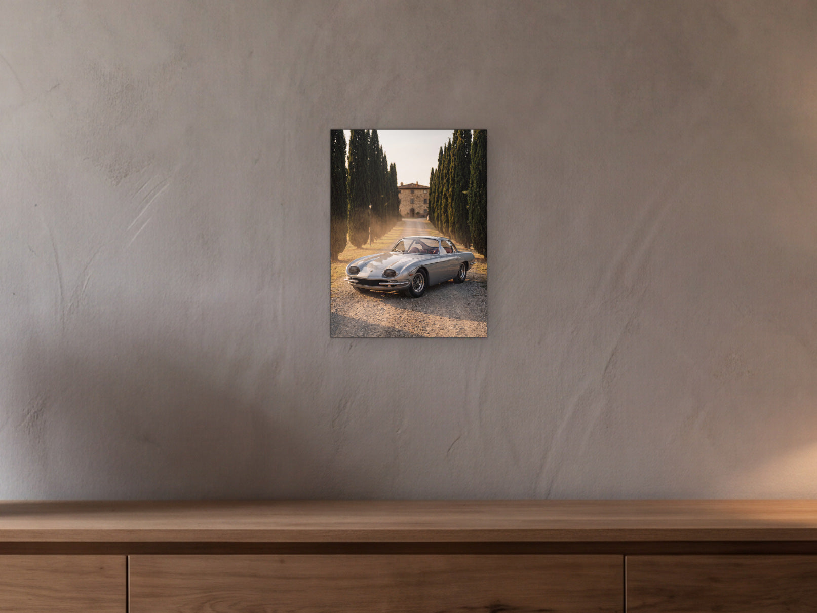 Lamborghini 350 GT - Cypress Avenue shown in a beamed room with a greige plaster wall above a long oak sideboard - scale render at 30 x 40 cm