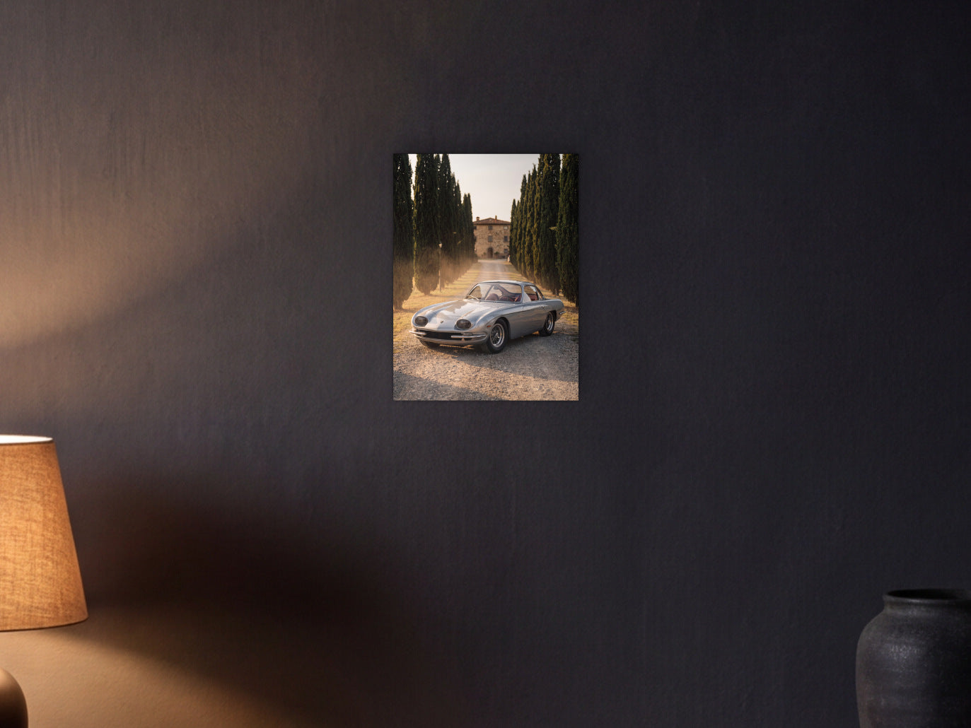 Lamborghini 350 GT - Cypress Avenue shown in a graphite plaster wall at night, lit by a console lamp - scale render at 30 x 40 cm