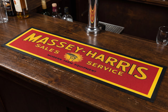 Massey-Harris Red Premium Rubber-Backed Bar Mat Runner on a bar top