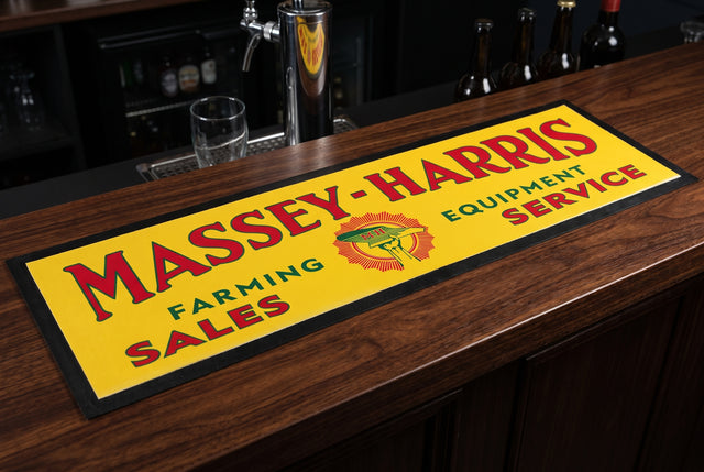 Massey-Harris Yellow Premium Rubber-Backed Bar Mat Runner on a bar top