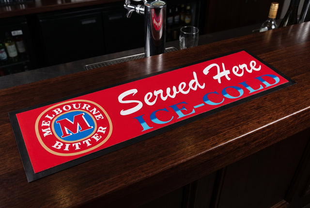Melbourne Bitter "Served Here Ice Cold" Premium Rubber-Backed Bar Mat Runner on a bar top