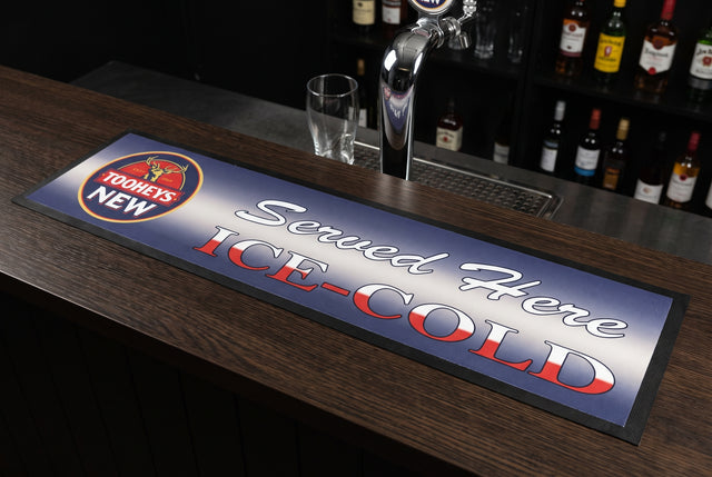 Tooheys "Served Here Ice Cold" Premium Rubber-Backed Bar Mat Runner on a bar top