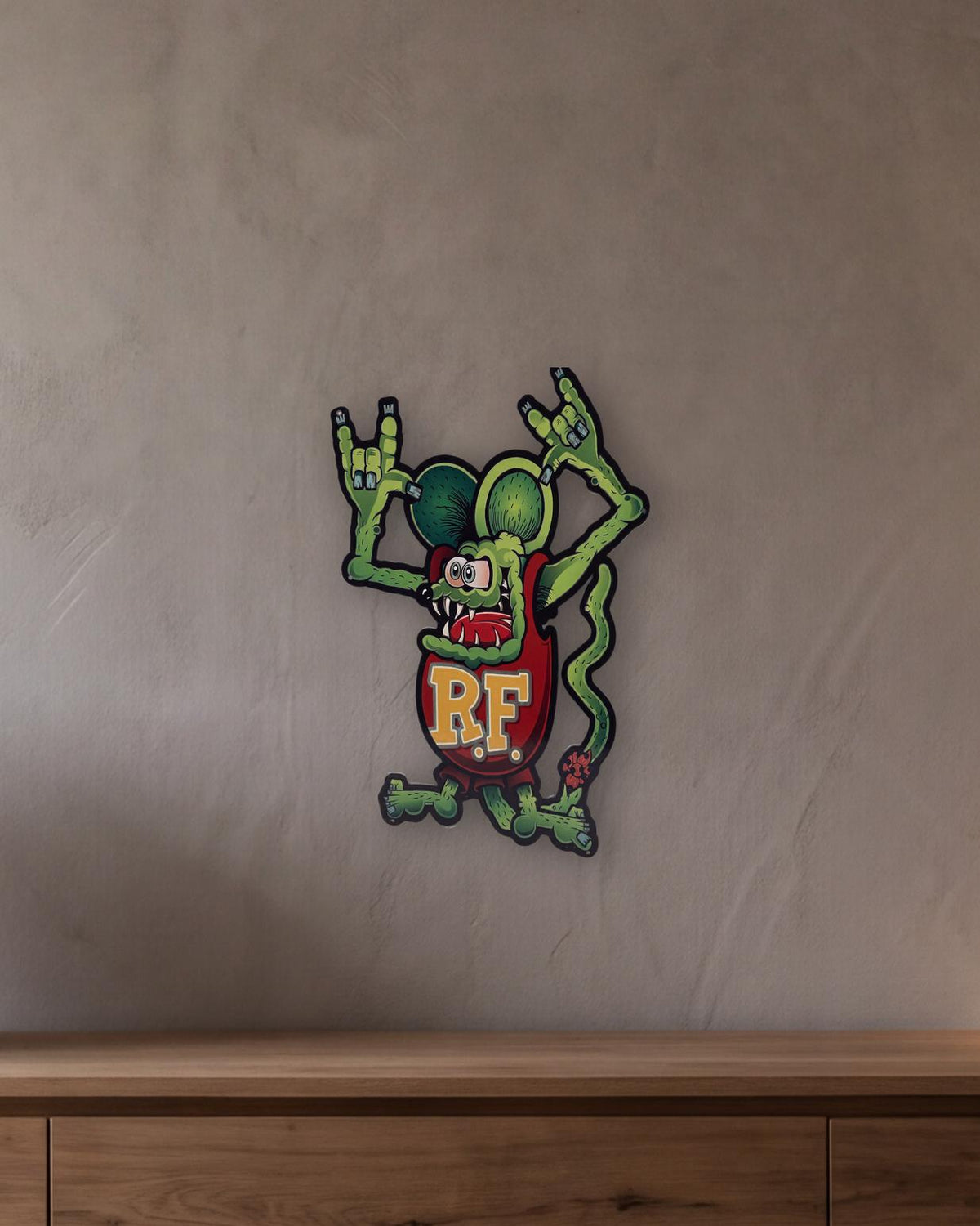 Rat Fink Scary Retro Metal Sign - 430 x 600mm shown in a room with a long oak sideboard - scale render at 430 x 600mm