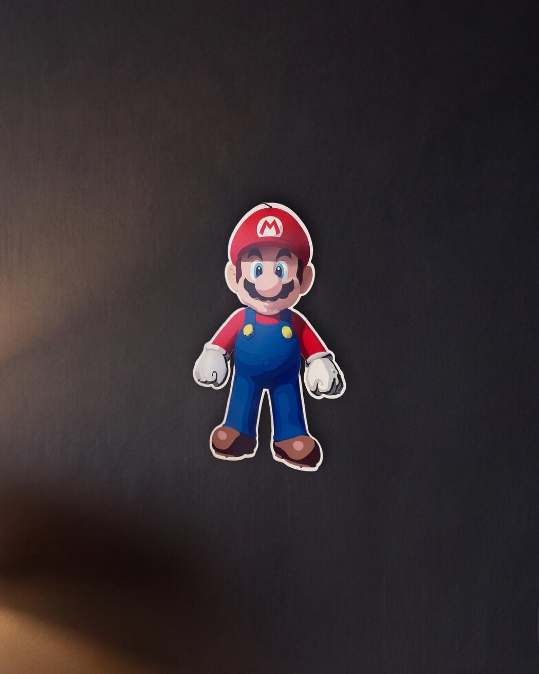 Super Mario Retro Metal Sign - 400 x 600mm shown in a night console - scale render at 400 x 600mm
