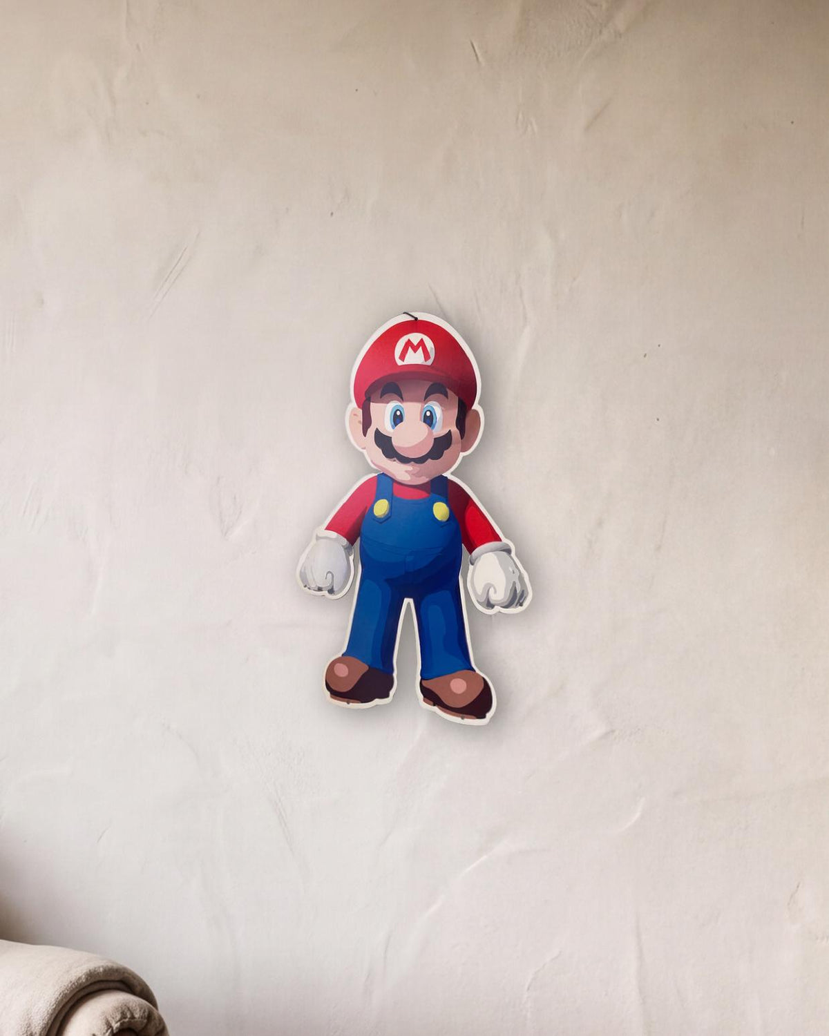 Super Mario Retro Metal Sign - 400 x 600mm shown in a reading corner - scale render at 400 x 600mm