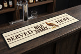 Wild Turkey Gold Premium Rubber-Backed Bar Mat Runner on a bar top