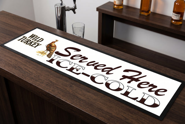 Wild Turkey "Served Here Ice Cold" Premium Rubber-Backed Bar Mat Runner on a bar top